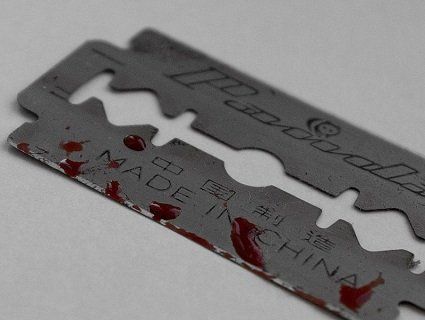 У луцькому суді двоє підозрюваних порізали собі вени